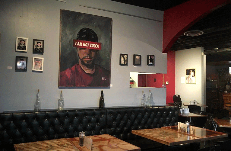 Carly's Bistro featuring artwork by Abe Zucca. Photo by Haley Ritter.
